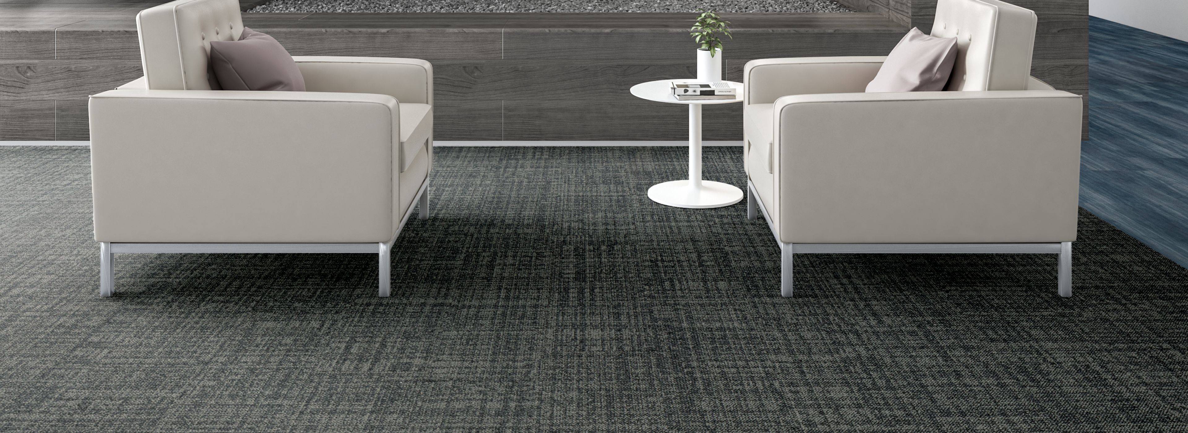 Interface Source Material plank carpet tile and Studio Set plank LVT in lobby with two white chairs and stairs image number 1